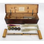 AN EARLY 20TH CENTURY F.H. AYRES LTD "THE WIMBLEDON" CASED CROQUET SET comprising four mallets