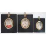 THREE REGENCY PORTRAIT MINIATURES PAINTED ON IVORY In ebonised frames, comprising a lady with