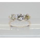 A THREE STONE DIAMOND RING the 18ct and platinum shank is set with estimated approx 1ct of brilliant