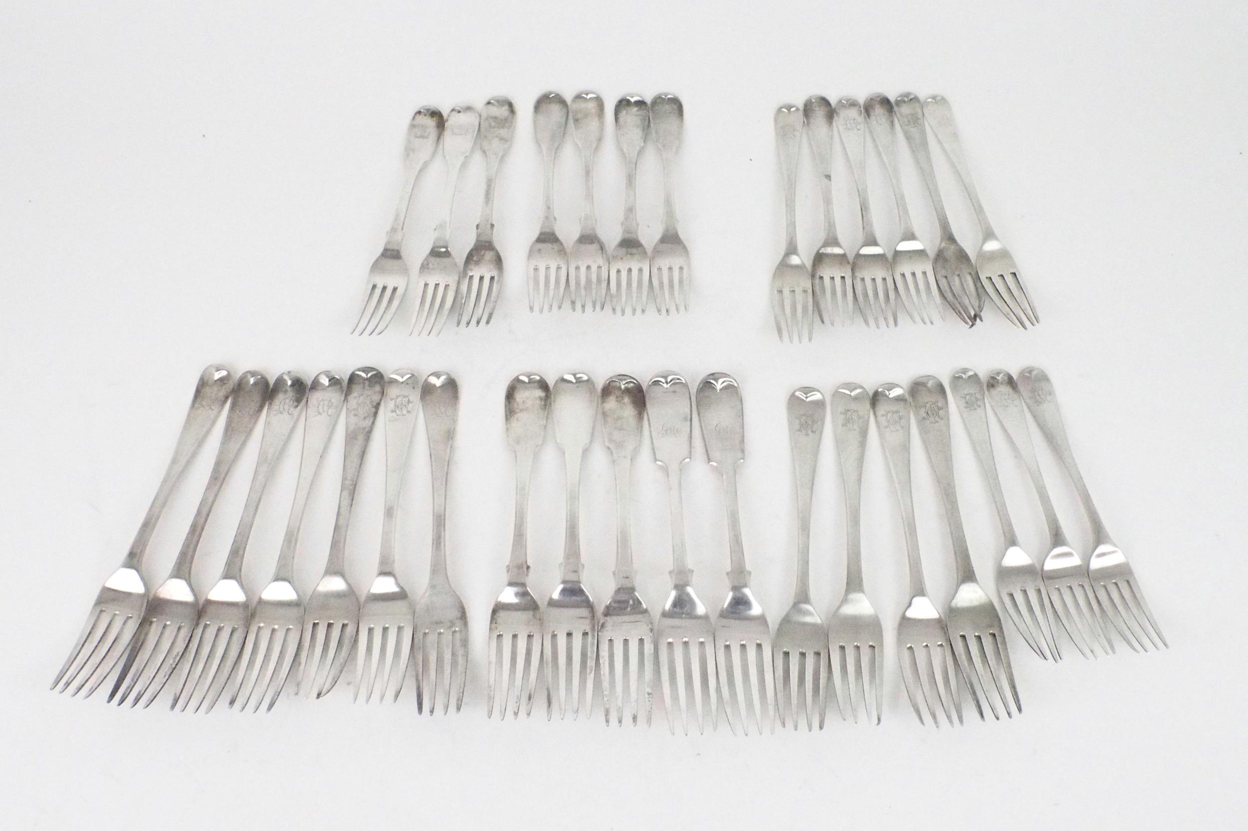 A COLLECTION OF GEORGIAN AND LATER SILVER FORKS including seven silver table forks by William Eley I