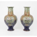 A PAIR OF ROYAL DOULTON VASES designed by Frank A Butler, of bulbous form with flaring neck