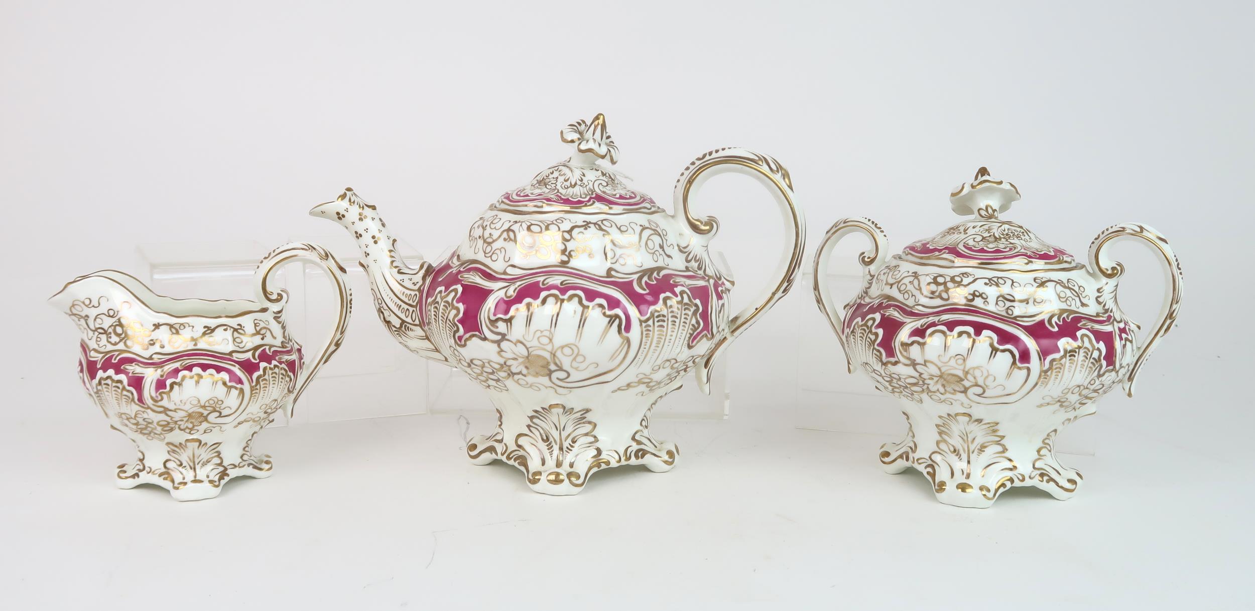 A ROCKINGHAM STYLE TEASET of moulded rococo design, the white ground with gilt vine and grape - Image 2 of 7