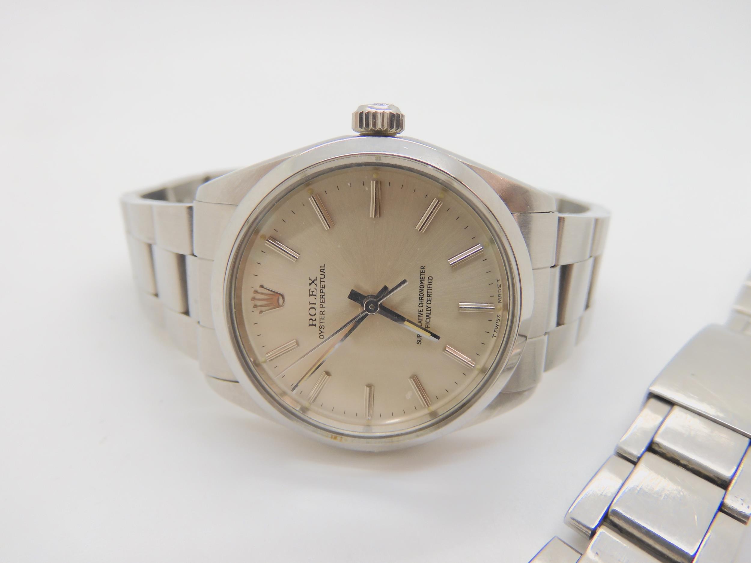 A ROLEX OYSTER PERPETUAL with stainless steel case and strap (78350). Silvered dial with silver - Image 2 of 8