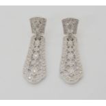 A PAIR OF DIAMOND DROP EARRINGS set with brilliant cut diamonds to the pierced and milgrain