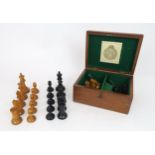 A JAQUES & SONS, LONDON STAUNTON PATTERN BOXWOOD AND EBONY CHESS SET In mahogany box, lined in green