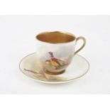 A ROYAL WORCESTER DEMITASSE CUP AND SAUCER each painted with pheasants and signed Maybury, date mark