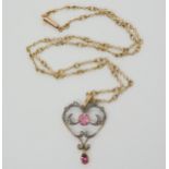 AN EDWARDIAN PENDANT set with pink tourmaline and old and rose cut diamonds, mounted in yellow and