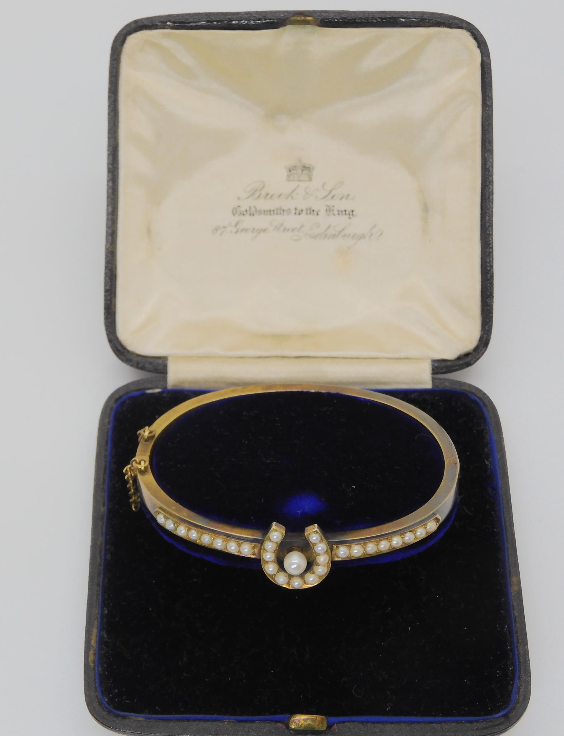 A PEARL SET HORSESHOE BANGLE mounted in yellow metal, with inscription to the inner shank dated - Image 3 of 5