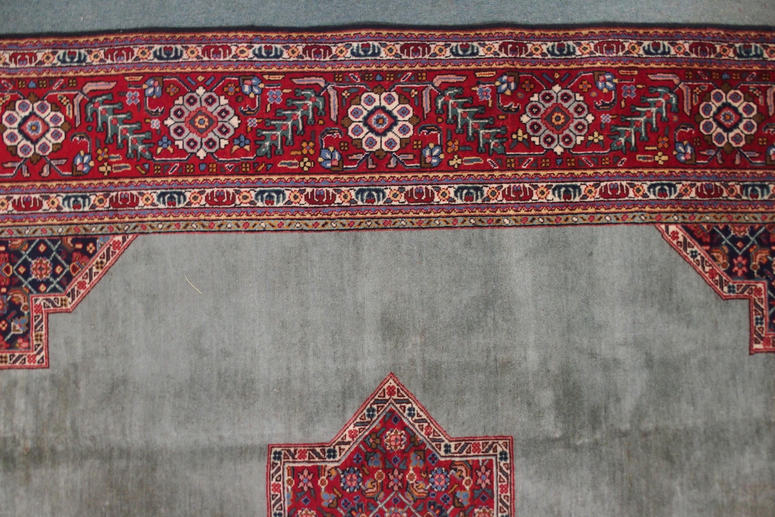A GREEN GROUND TABRIZ RUG with red geometric central medallion, dark blue and white spandrels and - Image 3 of 7