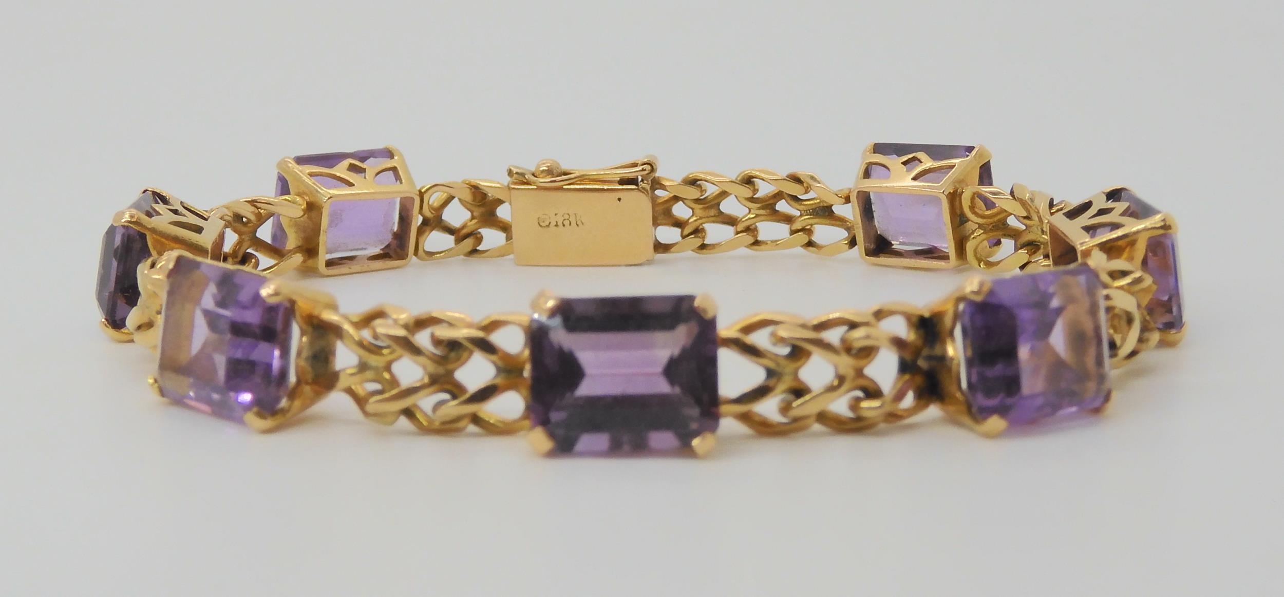 A FANCY LINK AMETHYST BRACELET the box clasp stamped 18k, and set with seven step cut amethysts with - Image 3 of 5