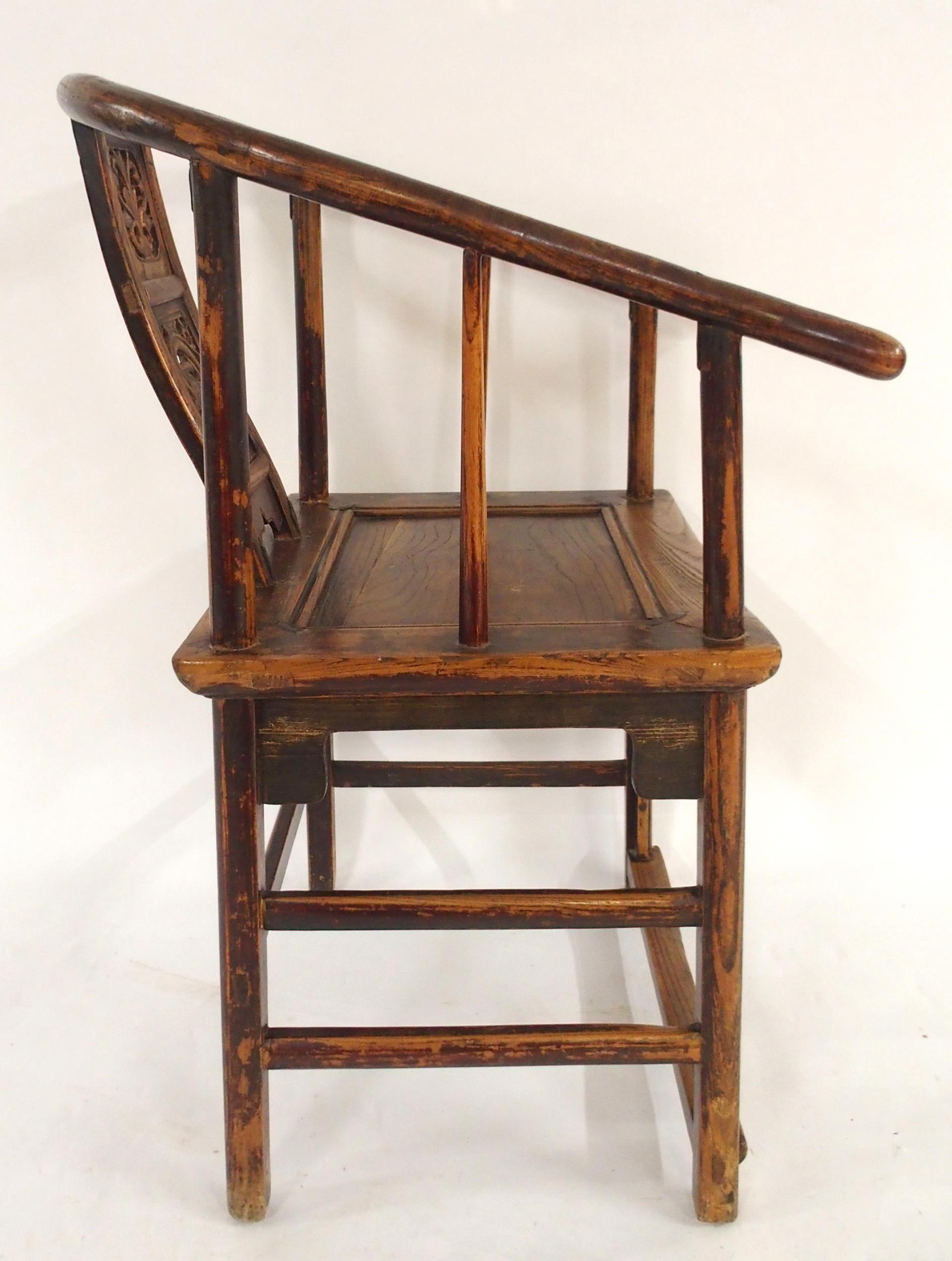 A CHINESE HARDWOOD HORSESHOE SHAPED ARMCHAIR with carved fret work splat on stretchered supports - Image 3 of 7