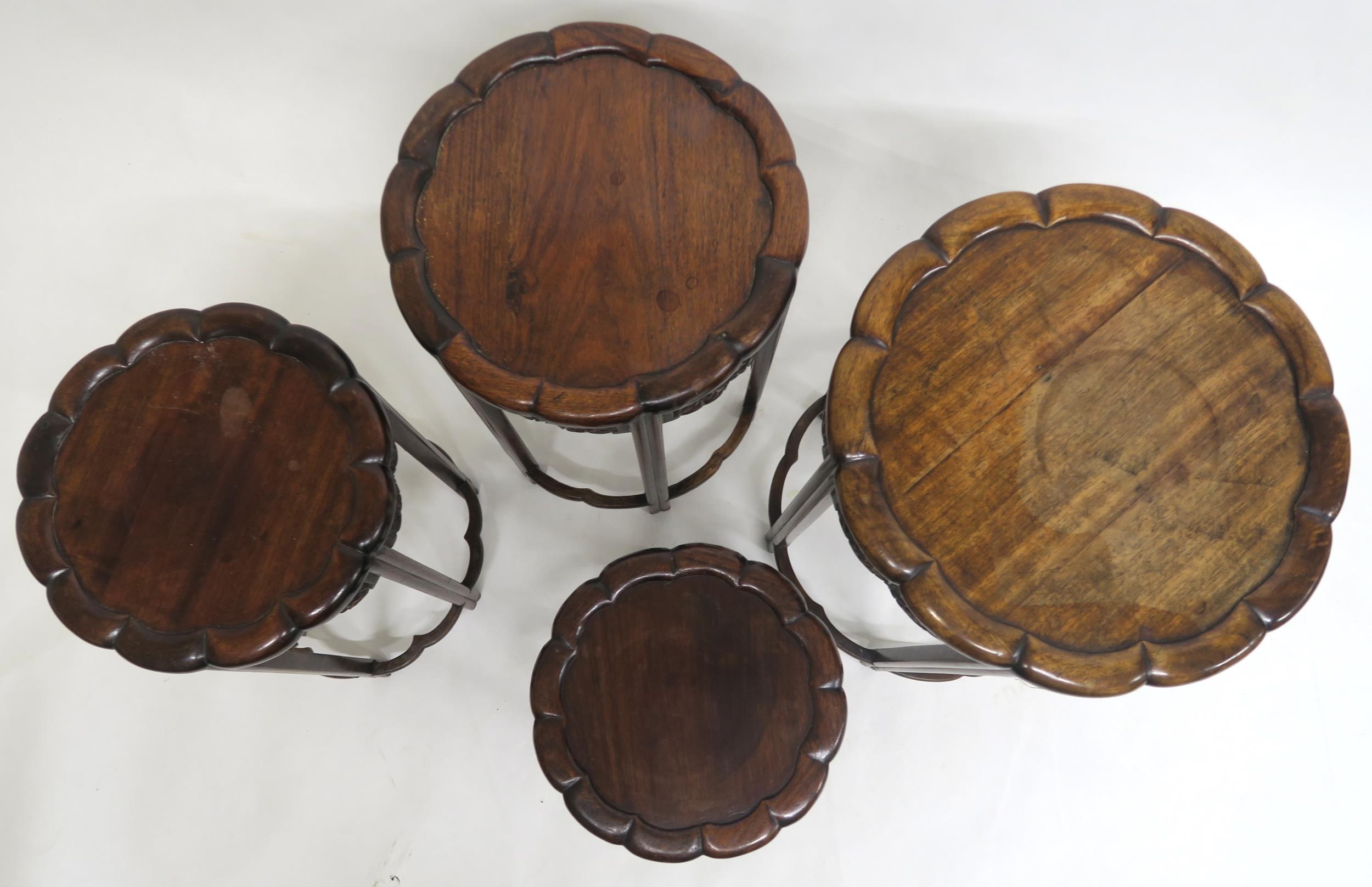 A 19TH CENTURY CHINESE HARDWOOD CIRCULAR NEST OF FOUR TABLES with shaped circular tops over carved - Image 5 of 7