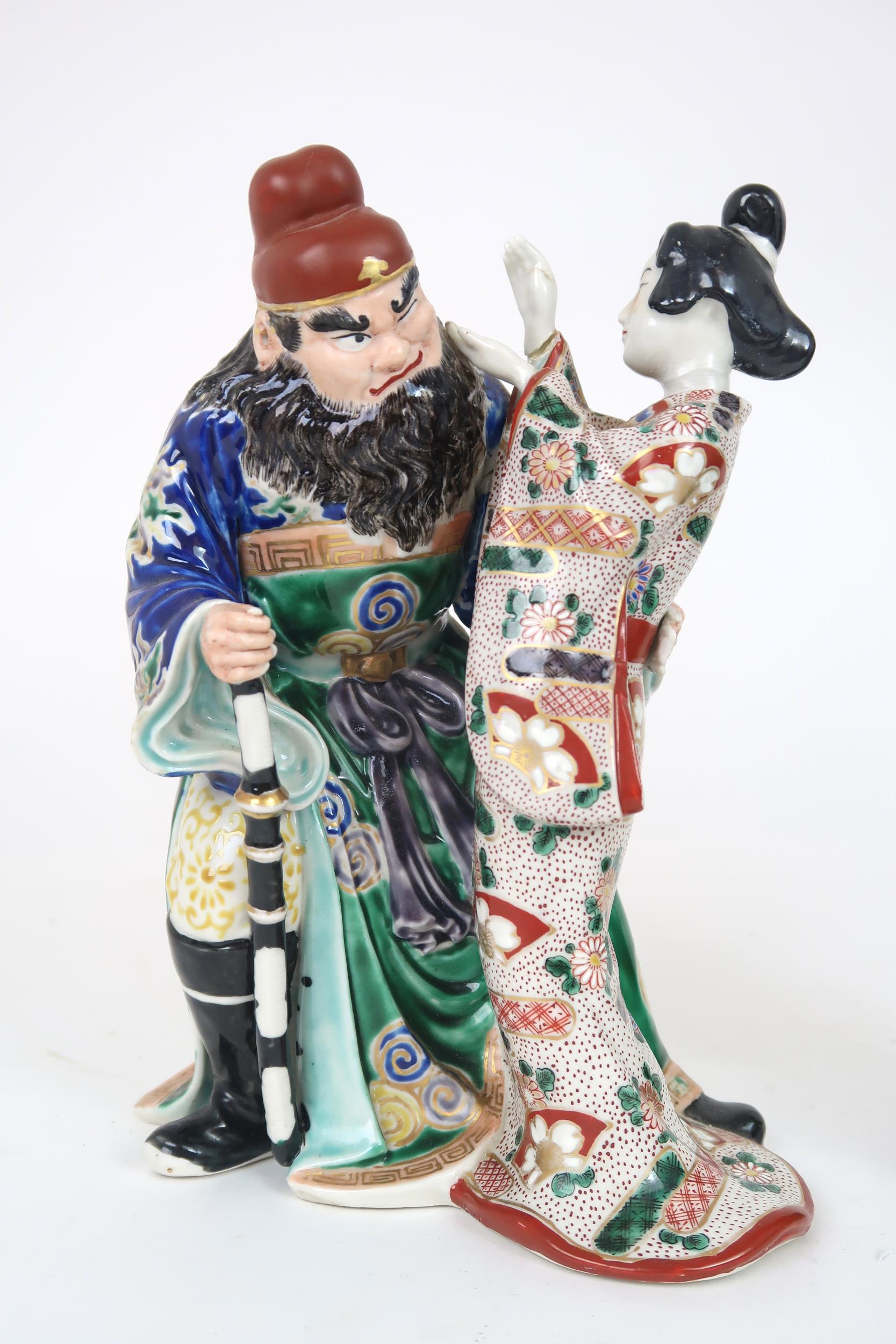 AN ARITA MODEL OF A WARRIOR AND GEISHA  She slapping his face and he grimacing, 25cm high, a Chinese - Image 2 of 18