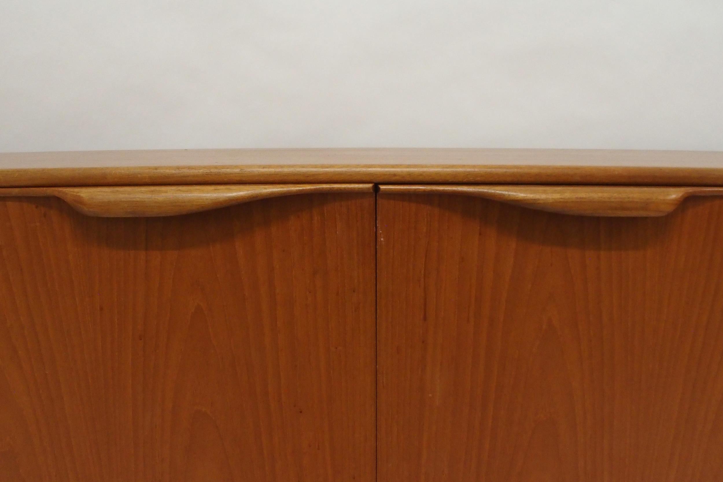 A MID 20TH CENTURY TEAK A.H. MCINTOSH OF KIRKCALDY SIDEBOARD with pair of cabinet doors flanked by - Image 11 of 12