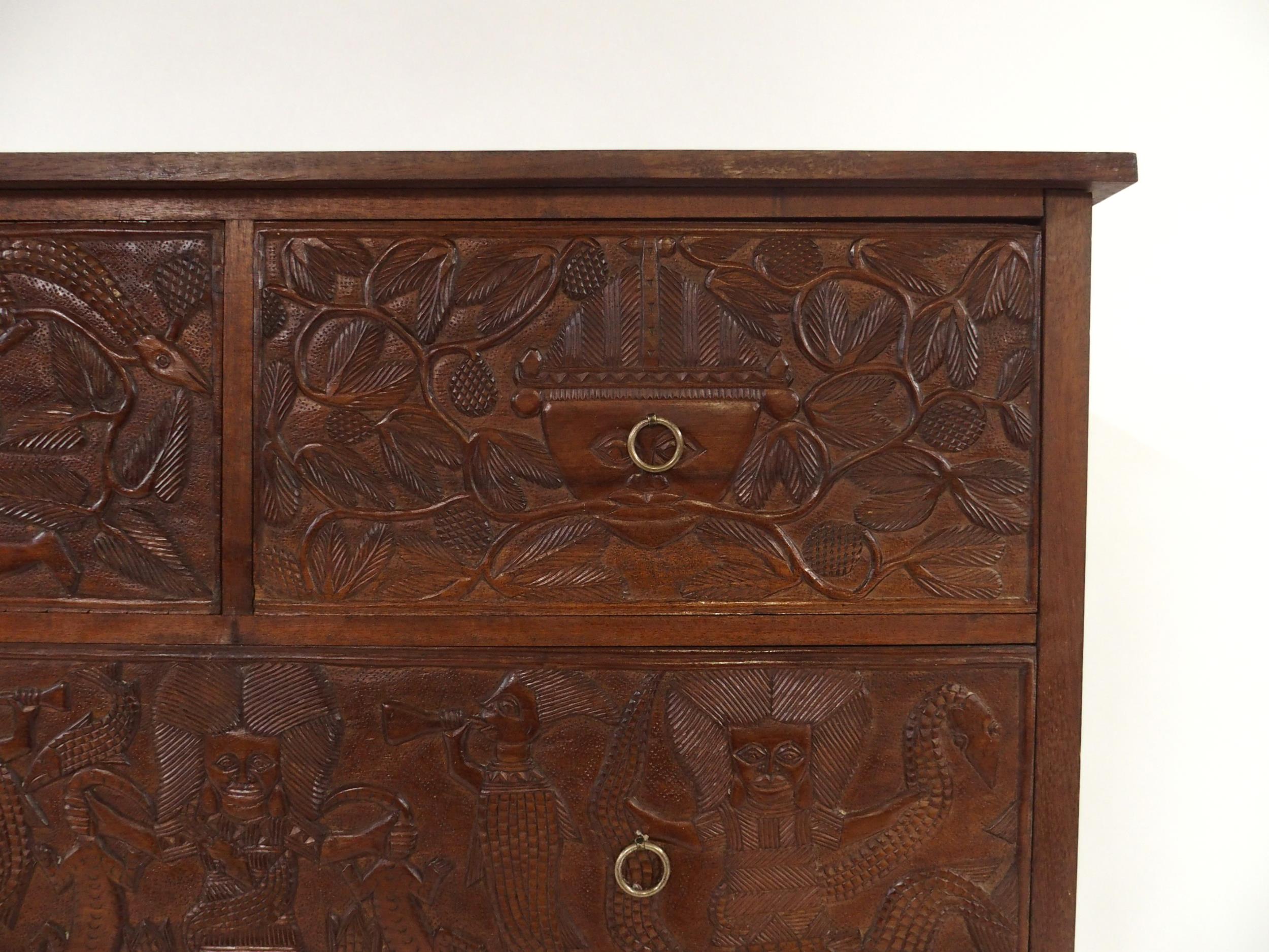 A 20TH CENTURY AFRICAN HARDWOOD TWO OVER TWO CHEST OF DRAWERS  with extensively carved drawer - Image 2 of 7