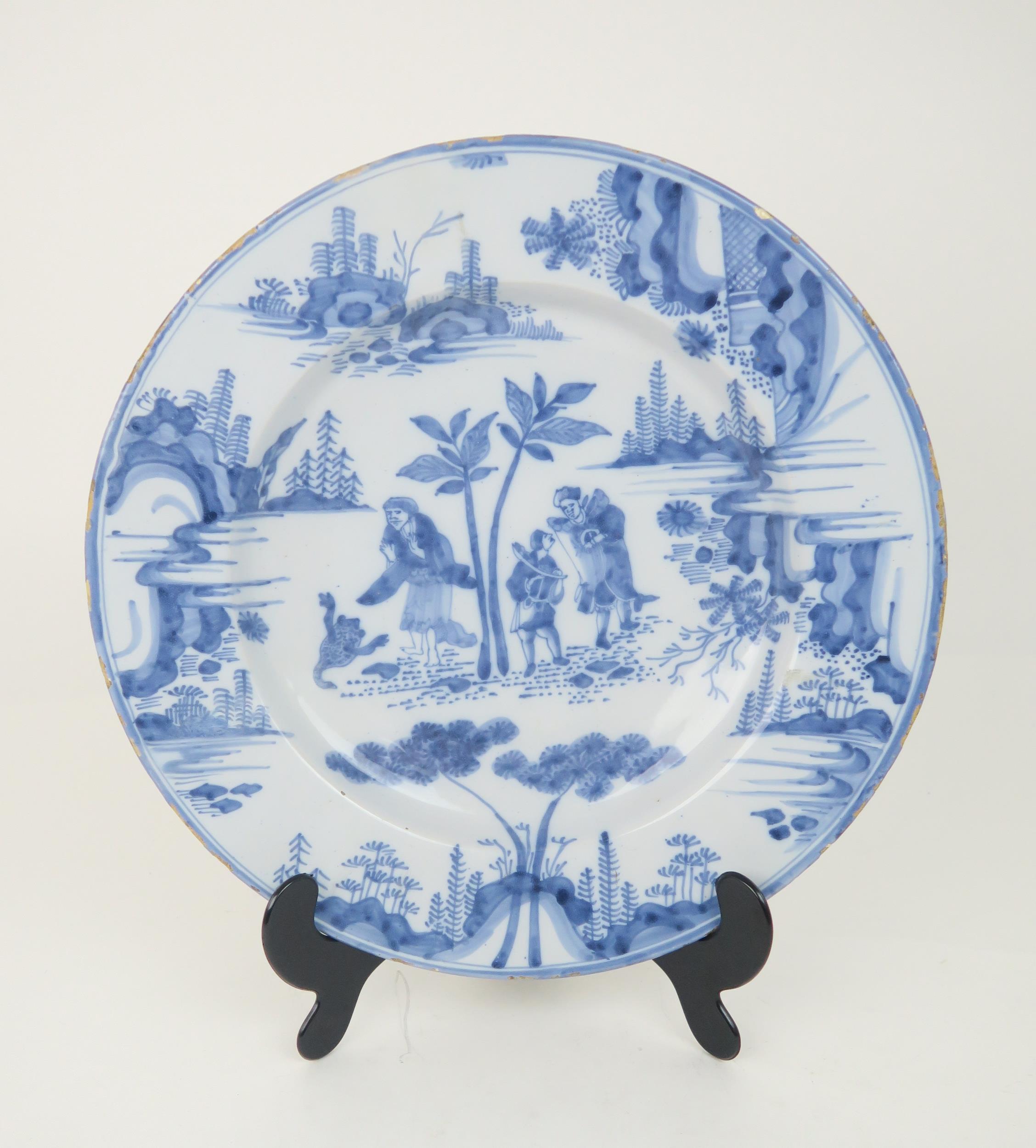 AN 18TH CENTURY DELFT CHARGER possibly north German Hanau, painted in blue and white with figures