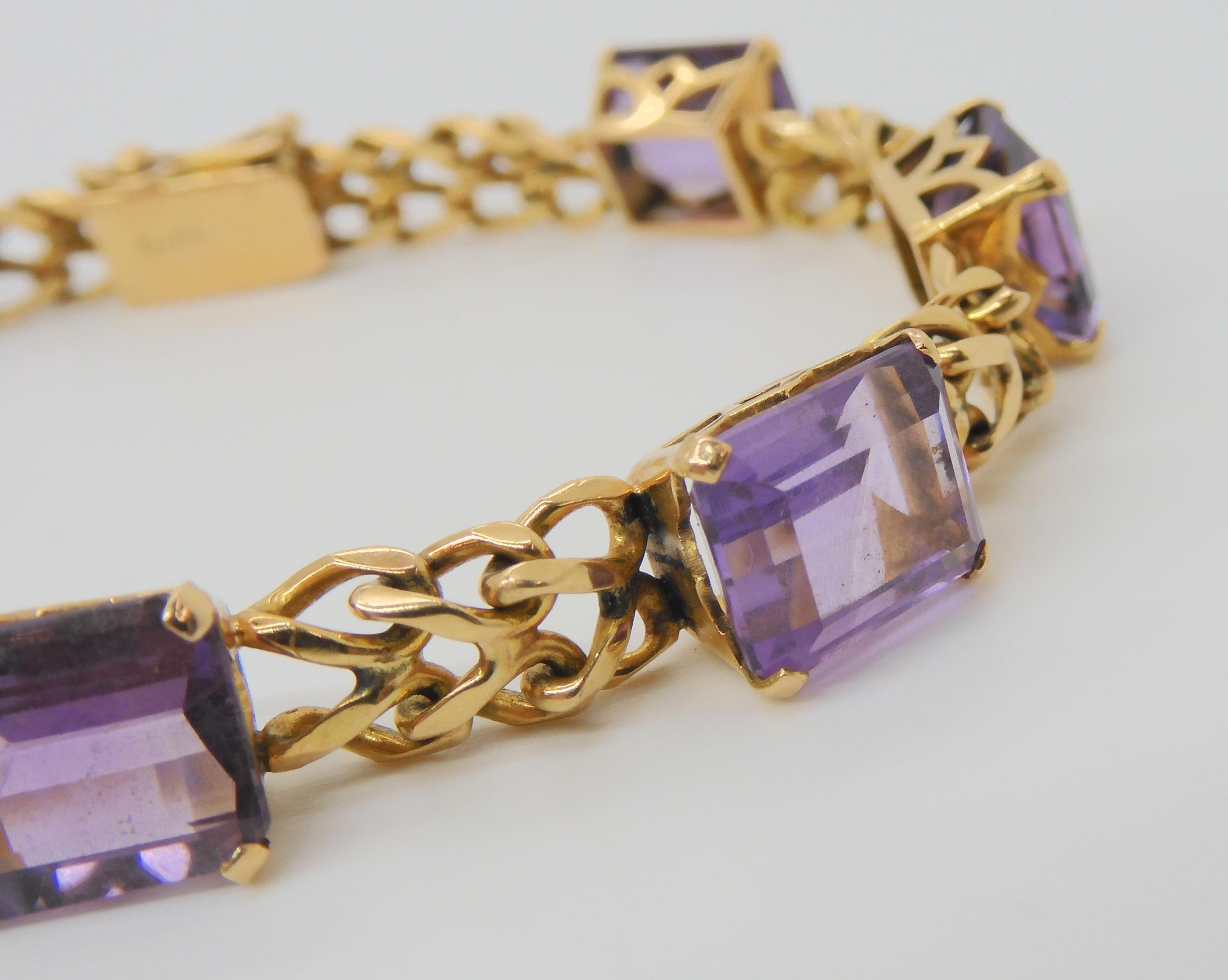 A FANCY LINK AMETHYST BRACELET the box clasp stamped 18k, and set with seven step cut amethysts with - Image 4 of 5