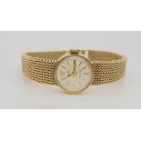 A 9CT GOLD LADIES ROLEX PRECISION white dial with gold coloured baton numerals and hands, with 9ct