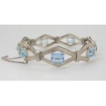 A RETRO WHITE METAL AQUAMARINE BRACELET the galleried diamond shaped links with all over