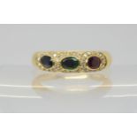 AN 18CT GOLD MIXED GEM RING set with sapphire, ruby and emerald with halos of diamonds, finger