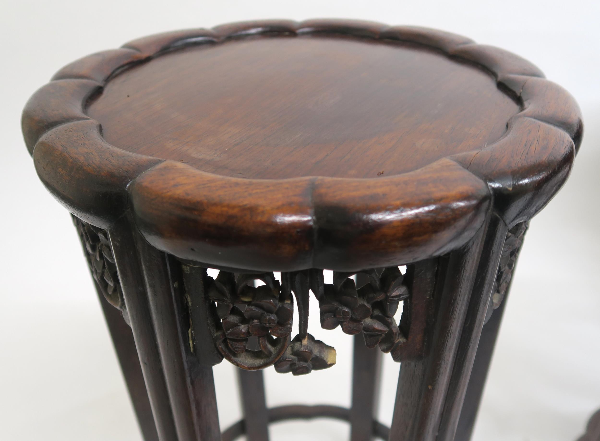 A 19TH CENTURY CHINESE HARDWOOD CIRCULAR NEST OF FOUR TABLES with shaped circular tops over carved - Image 6 of 7