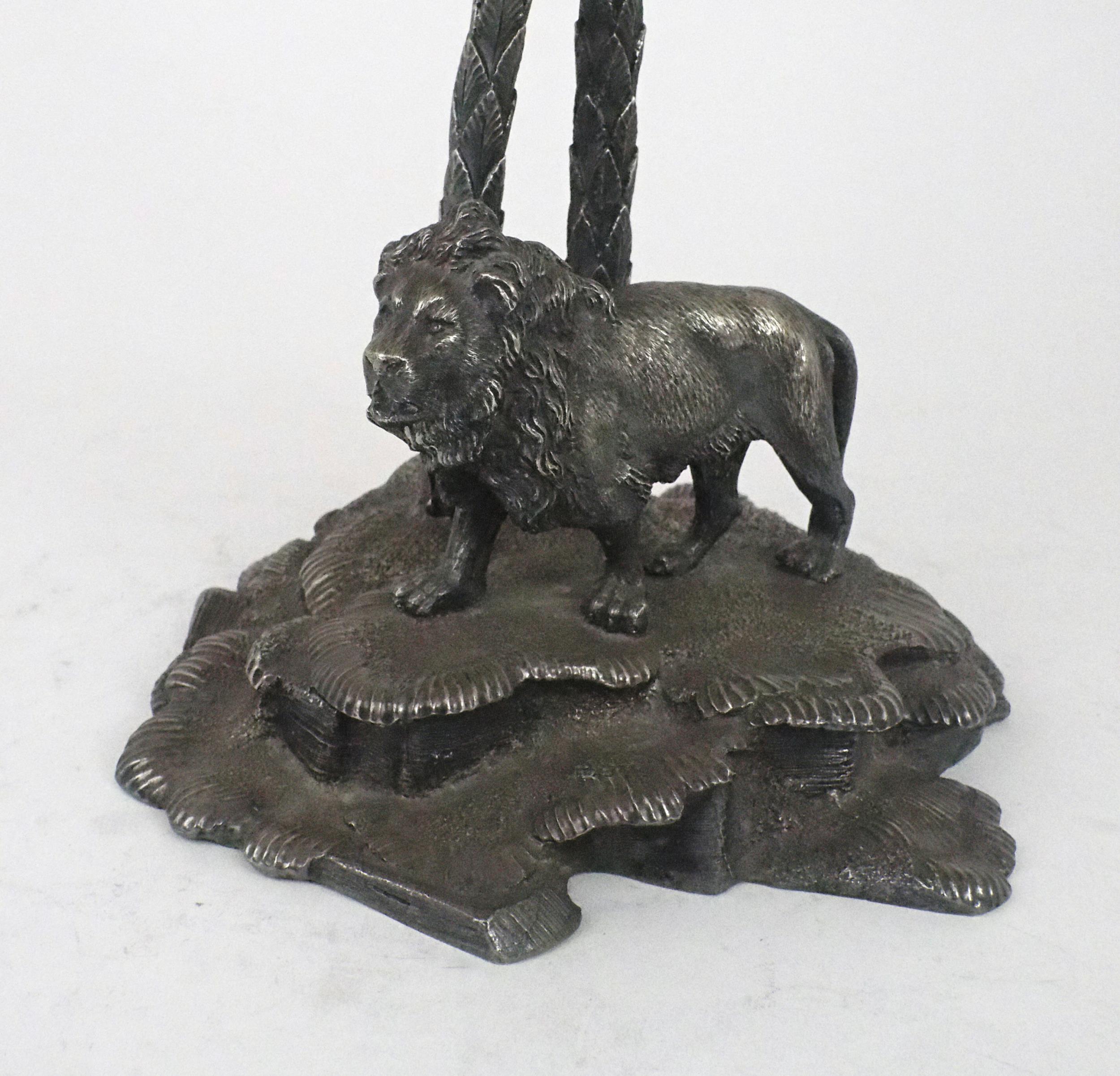 AN EPNS CUT GLASS CENTREPIECE in the style of Elkington & Co, modelled as a lion standing on a leafy - Image 2 of 5