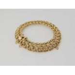 AN 18CT GOLD FANCY DOUBLE LINK BRACELET with box clasp, length 19.5cm, weight 31.8gms Condition