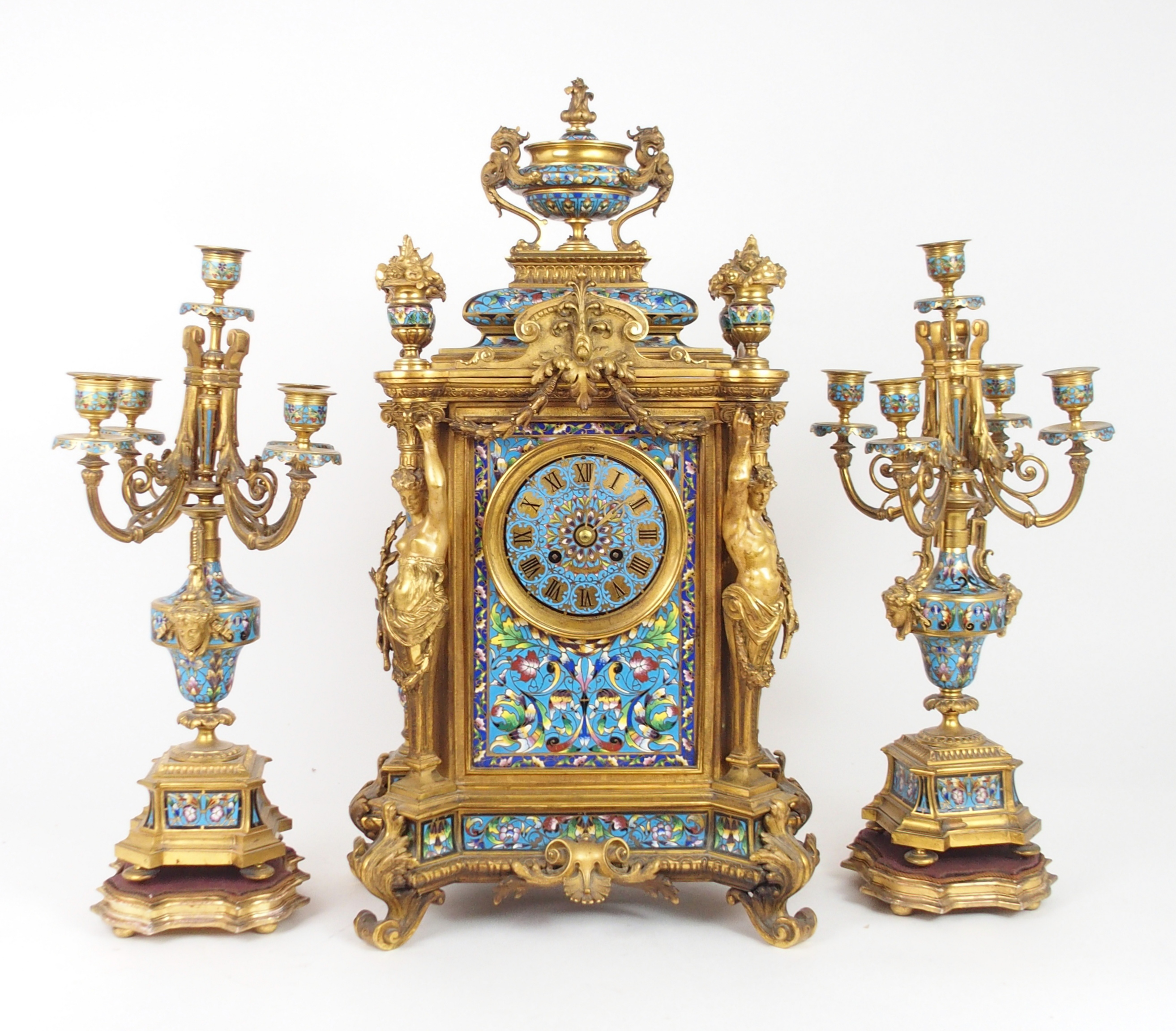 AN IMPRESSIVE 19TH CENTURY FRENCH CHAMPLEVE ENAMEL MANTLE CLOCK the urn mounted top with griffin han