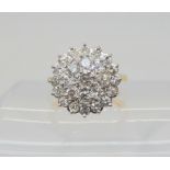 A SUBSTANTIAL DIAMOND CLUSTER RING set with estimated approx 1ct of brilliant cut diamonds, finger