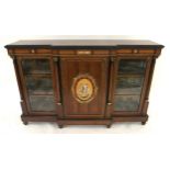 A VICTORIAN WALNUT AND EBONISED BREAKFRONT CREDENZA  with ormolu mounts, four columns with a pair of