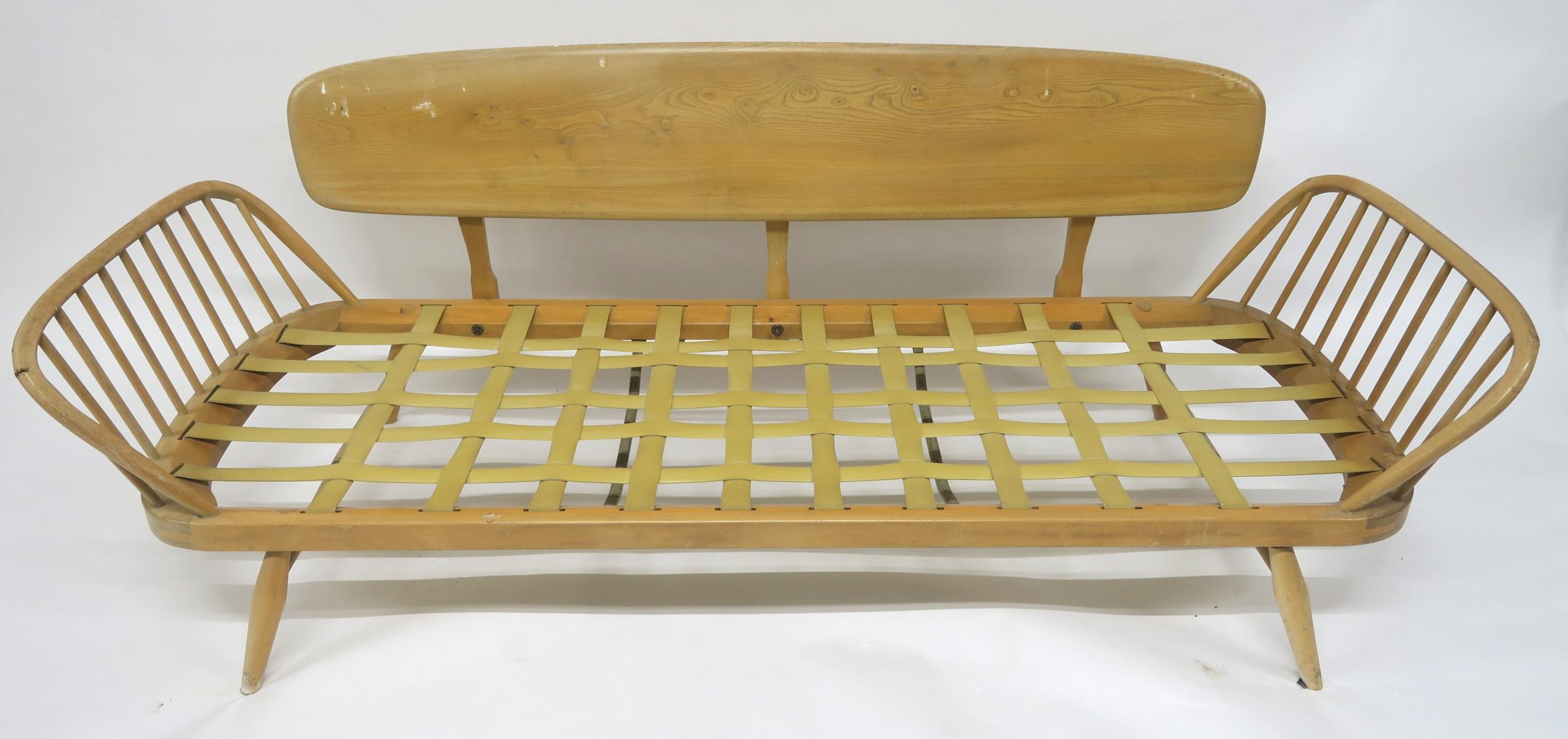 A MID 20TH CENTURY ELM AND BEECH FRAMED ERCOL DAY BED with floral upholstered cushions, 77cm high - Image 10 of 11