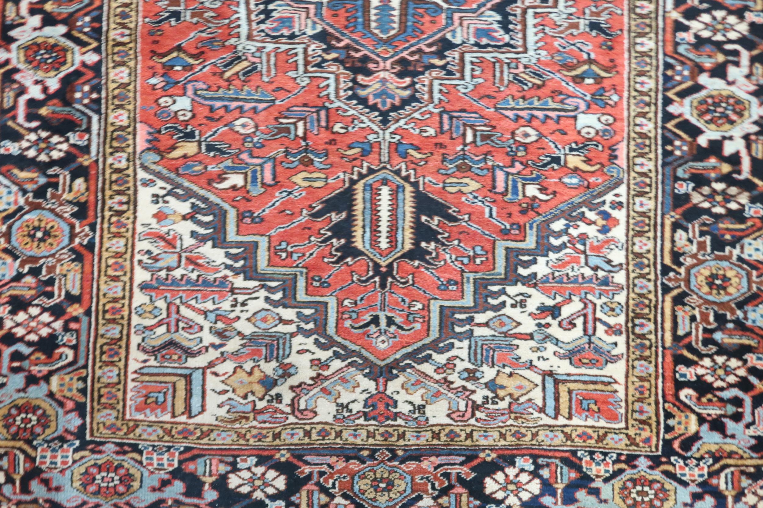 A RED GROUND KAZAK RUG with dark blue geometric central medallion, off white spandrels and geometric - Image 4 of 7