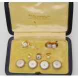 A BOXED SET OF BUTTONS & STUDS Four 18ct gold and white metal mother of pearl and pearl set buttons,