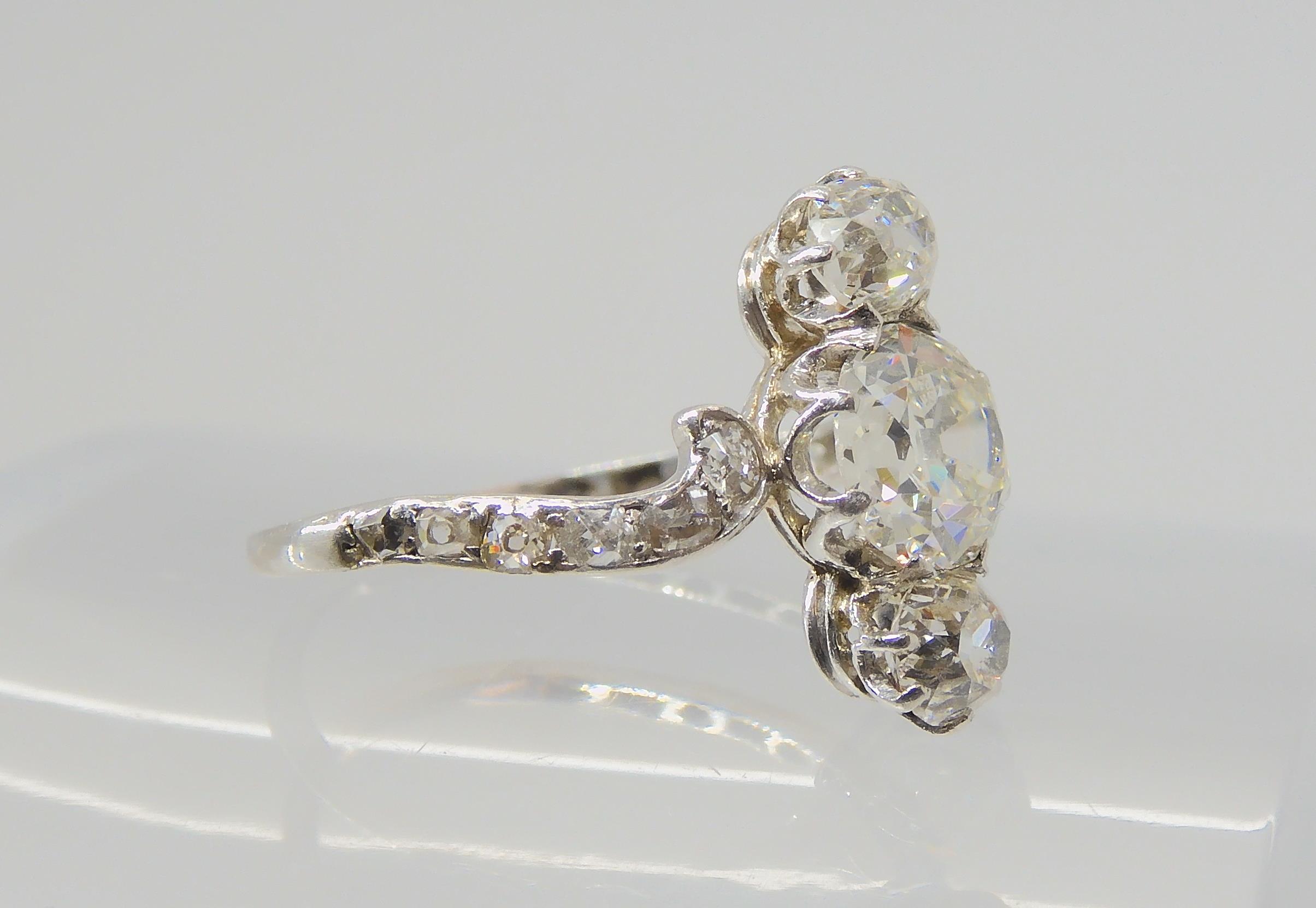 A VINTAGE THREE STONE DIAMOND RING the central old cut is estimated approximately at 0.95cts, with - Image 9 of 12