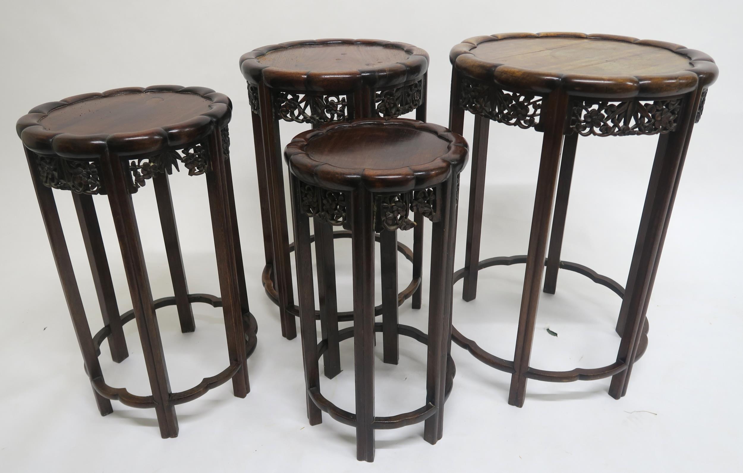 A 19TH CENTURY CHINESE HARDWOOD CIRCULAR NEST OF FOUR TABLES with shaped circular tops over carved - Image 2 of 7