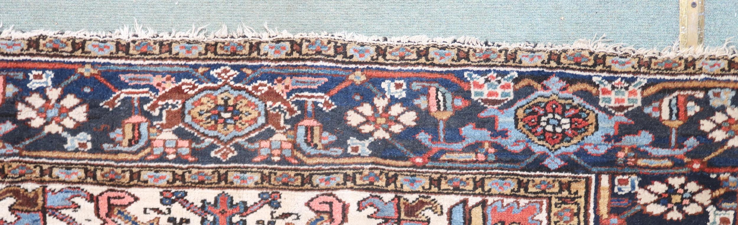 A RED GROUND KAZAK RUG with dark blue geometric central medallion, off white spandrels and geometric - Image 7 of 7