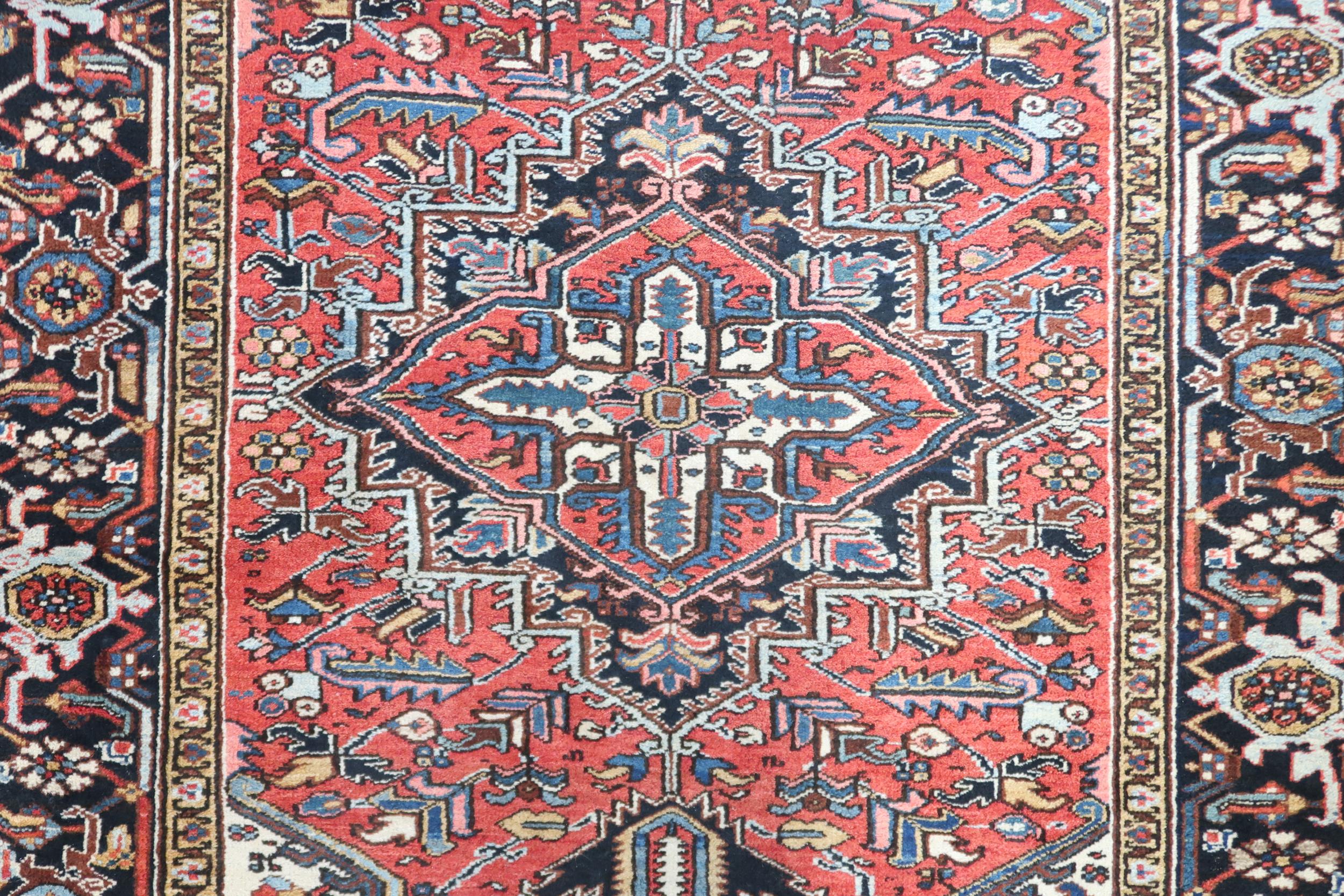 A RED GROUND KAZAK RUG with dark blue geometric central medallion, off white spandrels and geometric - Image 5 of 7