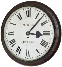 Norfolk & Suffolk Joint Railway 16in dial teak cased railway clock with a cast brass bezel with