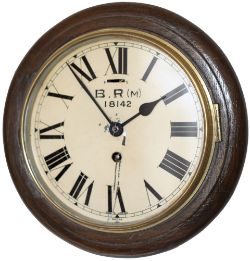 BR(M) 8 inch oak cased railway clock with a spun brass bezel and a Smiths going barrel platform