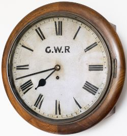 GWR 12in dial mahogany cased railway clock with a spun brass bezel and a wire driven fusee