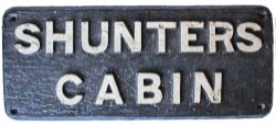 Wooden sign with cast iron letters SHUNTERS CABIN. Measures approximately 17in x 7in and is in
