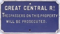 GCR cast iron Trespass Sign in restored condition, white lettering on a blue ground.