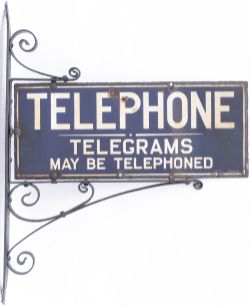 Enamel sign TELEPHONE TELEGRAMS MAY BE POSTED with original steel wall mounting bracket. Both