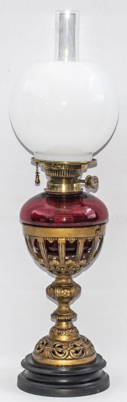 London & South Western Railway table oil lamp with ornate cast iron base with SWR cast underneath,