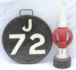 Circular steel Reporting Disc J72 with Laira painted on rear. Top carry handle and rear boss for