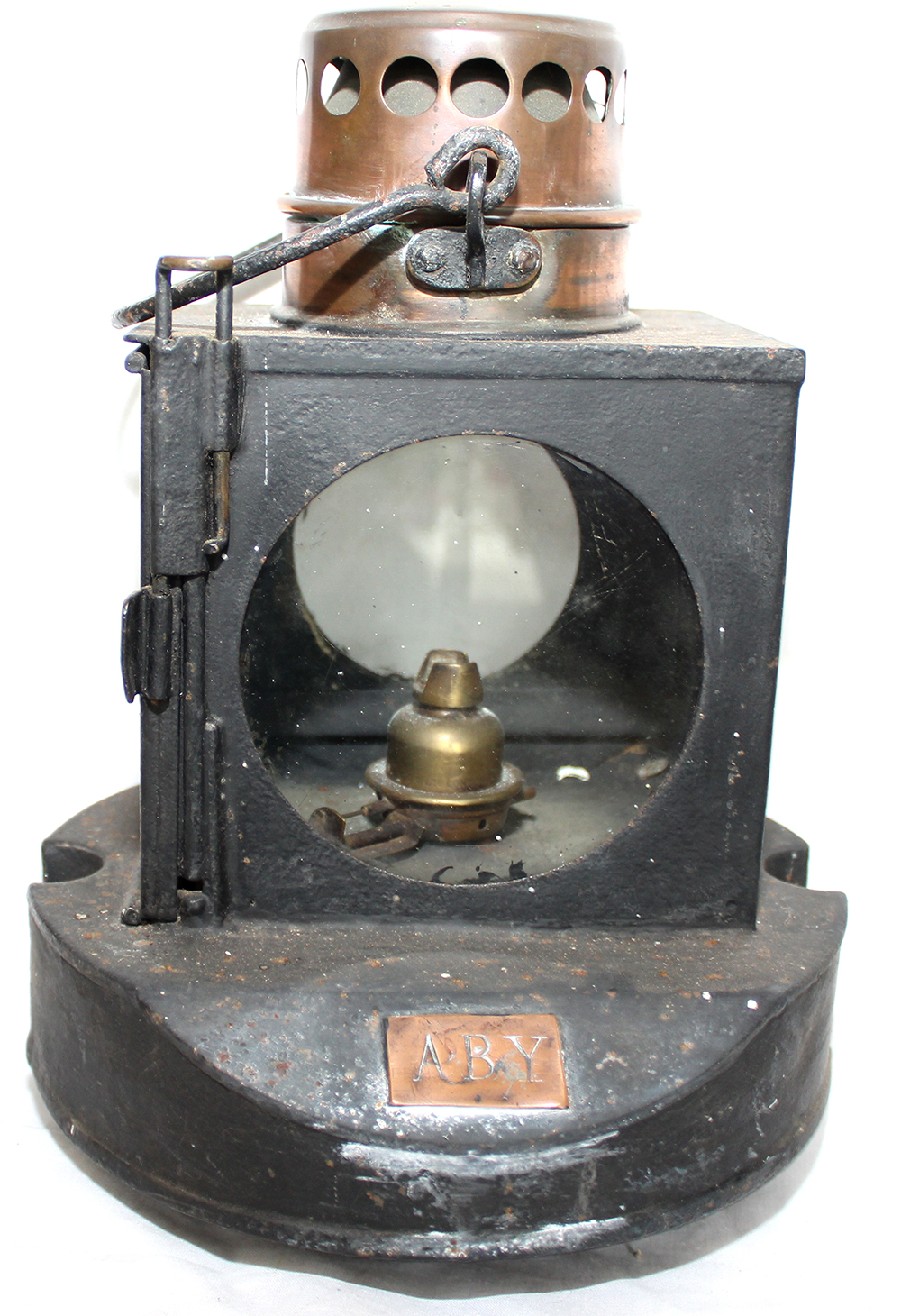 GNR Signal Lamp interior with copper chimney. Copper plate on sloping front stamped ABY. Integral