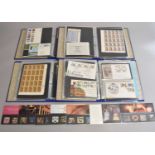 A collection of eight albums of Great Britain mint and used stamps and F.D.C.'s