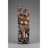 A Chinese carved hardwood laughing Buddha table lamp