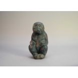 A Chinese Han style stoneware figure of a monkey