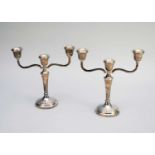 A pair of silver mounted two-branch candelabra